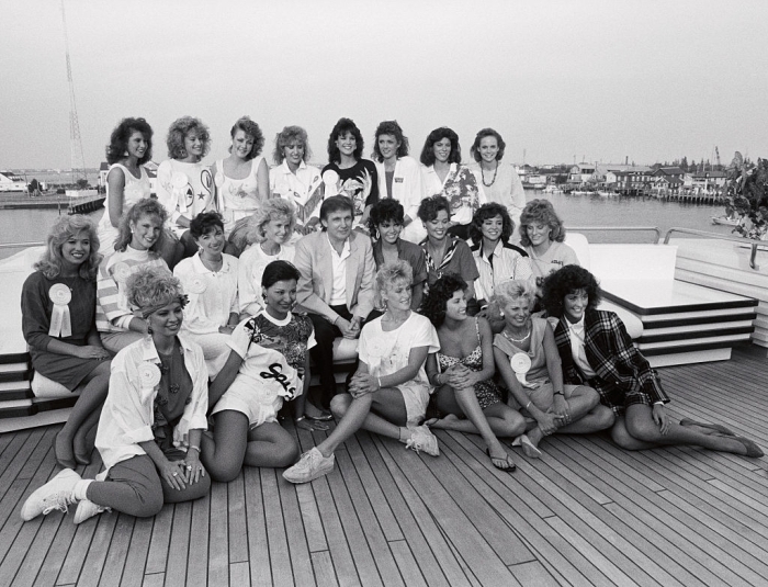 Donald Trump with a group of beauty queens on a yacht, connected to the alleged 1993 a*****t claims.