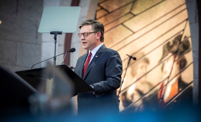 A man speaking at a podium, an uplifting event of hope and renewal, related to the House GOP's defense plan. A man speaking at a podium, an uplifting event of hope and renewal, related to the House GOP's defense plan.