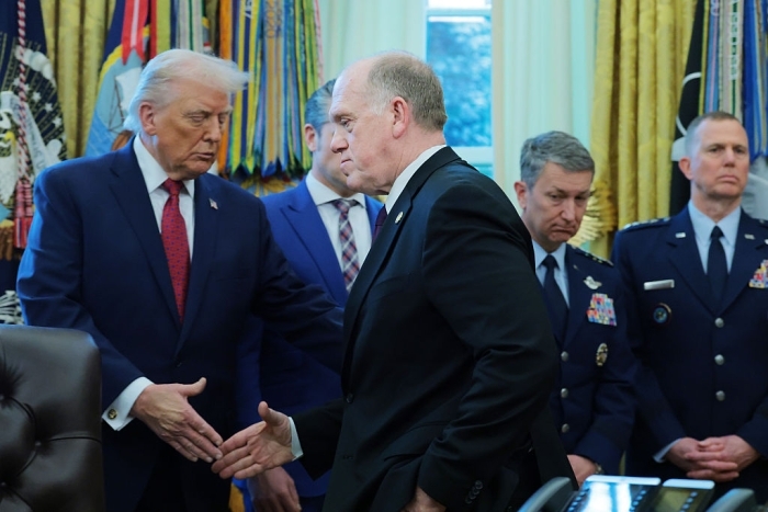 Trump and Border Czar Tom Homan shaking hands, discussing potential ICE border bloodshed with other officials present. Trump and Border Czar Tom Homan shaking hands, discussing potential ICE border bloodshed with other officials present.