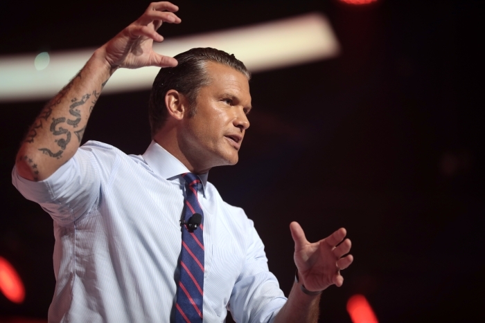 Pete Hegseth speaking at an event, discussing the Iranian strike on Jordan Base.