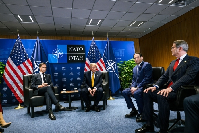 Donald Trump with other officials at a NATO meeting, after Iranian strike on Jordan Base.