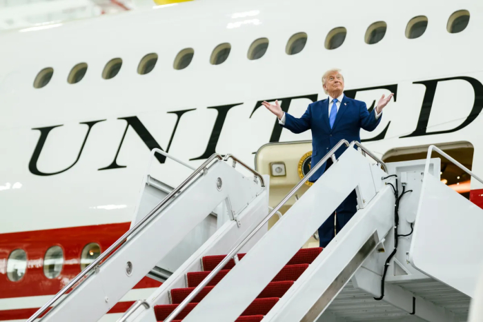 Trump stands on the stairs of Air Force One, gesturing. He admits Qatari Jet lacks Air Force One's defense systems. Trump stands on the stairs of Air Force One, gesturing. He admits Qatari Jet lacks Air Force One's defense systems.