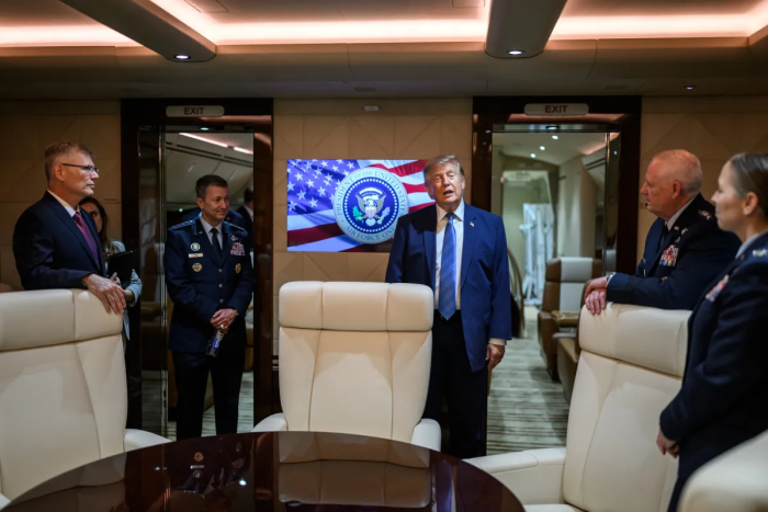 Trump addresses military personnel inside Air Force One, discussing Qatari Jet defense systems. Trump addresses military personnel inside Air Force One, discussing Qatari Jet defense systems.