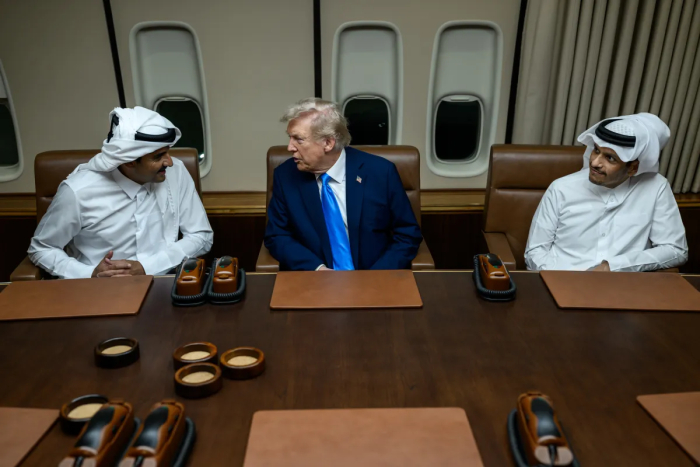 Trump and Qatari officials converse inside the jet, discussing the Qatari Jet's defense systems. Trump and Qatari officials converse inside the jet, discussing the Qatari Jet's defense systems.