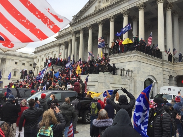 Crowd of Trump supporters marching on the US Capitol on 6 January 2021, ultimately leading the building being breached and several deaths.